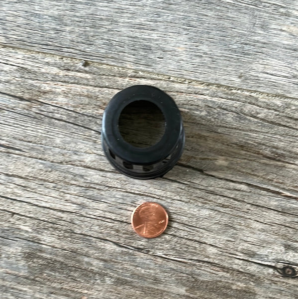 a 1 5/8" tiny black net pot with a penny for size - showing the bottom hole