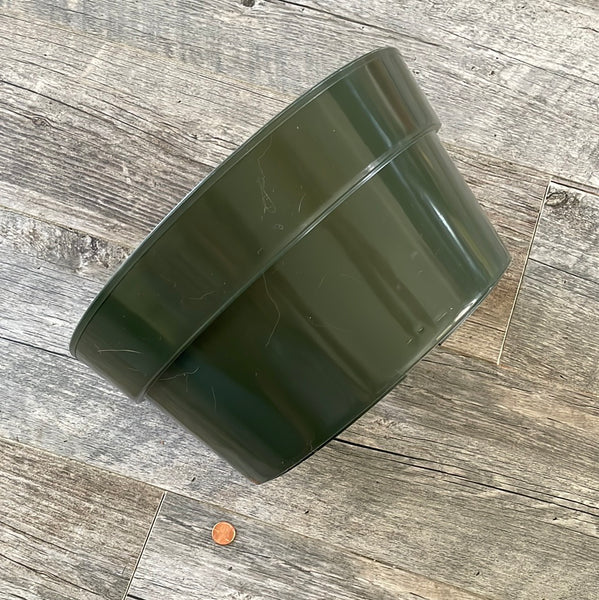 sideways view of a 12 inch round shallow green plastic flower pot