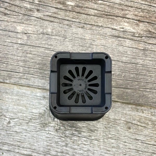 the bottom of a black plastic square flower pot