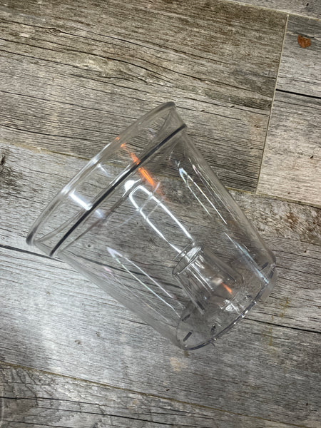 a spectacularly clear round 5.7" orchid pot with large aeration cone in the bottom of the pot - side view