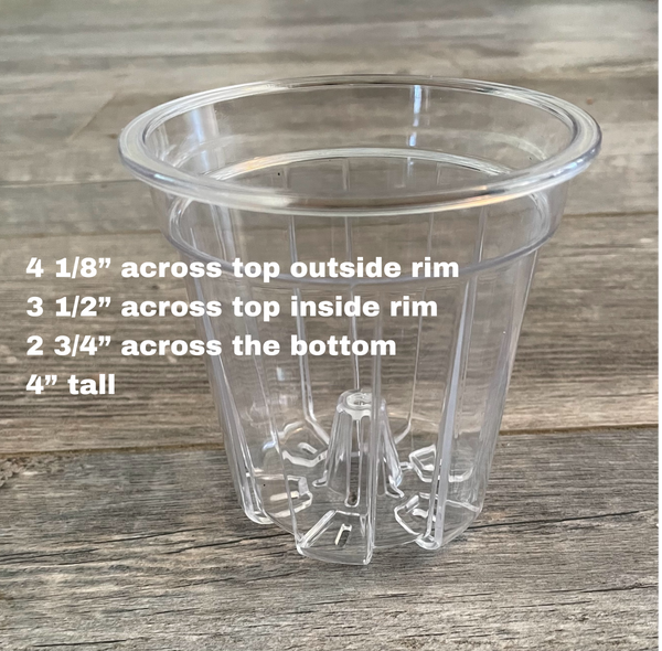a small clear plastic flower pot with a wooden background and text
